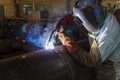 Welder is welding added joint a pipe carbon for steel structure work with process Flux Cored Arc Welding(FCAW) Royalty Free Stock Photo