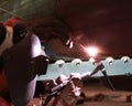 Welder is welding at the big column with MIG Method Royalty Free Stock Photo
