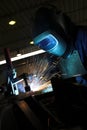 Welder welding a metal part