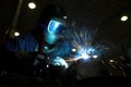 Welder welding a metal part