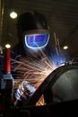 Welder welding a metal part