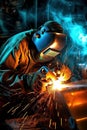 welder is welding metal part in car factory