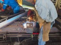 Welder welding a steel plate for steel structure work with process Flux Cored Arc Welding(FCAW) Royalty Free Stock Photo