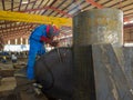 Welder is welding a steel plate for steel structure work with process Flux Cored Arc Welding& x28;FCAW& x29; Royalty Free Stock Photo