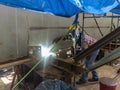 The welder is welding a steel structure work with process Flux Cored Arc WeldingFCAW