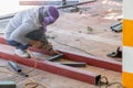 The welder is welding the structure on the floor Royalty Free Stock Photo