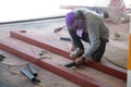 The welder is welding the structure on the floor Royalty Free Stock Photo