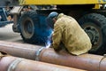 Welder welds pipe segments. Repair and replacement of outdated p Royalty Free Stock Photo