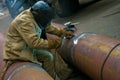 Welder welds pipe segments. Repair and replacement of outdated p Royalty Free Stock Photo