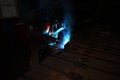 Welder at work for close-up work, joining parts with welding. Workplace in the factory.