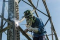 Welder work at high Electric high voltage pole 230 Kv.