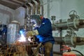 Welder worker at industrial arc welding work Royalty Free Stock Photo