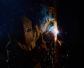 Welder worker welding metal by electrode Royalty Free Stock Photo