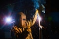 Welder worker welding metal by electrode Royalty Free Stock Photo