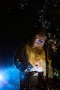 Welder worker welding metal by electrode Royalty Free Stock Photo