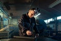 Welder working with autogenous welding tool in workshop Royalty Free Stock Photo