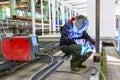 Welder is working at the factory and welding a metal construction Royalty Free Stock Photo