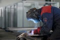 Welder working on factory, Welding Work. Erecting Technical Steel Industrial Craftsman on plant.