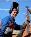 A welder working at height