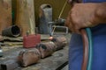 Welder working on iron to make cowbell