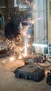 Welder working in a steel factory with sparks flying Royalty Free Stock Photo