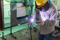 Welder is working welding pipe carbon with process Tungsten Inert Gas Welding & x28;TIG& x29; or Gas Tungsten Arc Welding GTAW Royalty Free Stock Photo