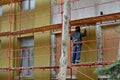 Welder works at the building of a house