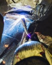 Welder works on a vehicle