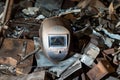 welders mask surrounded by metal scraps Royalty Free Stock Photo
