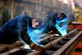 Welders work at the factory