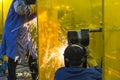 The welding craftsman grinding the steel tube