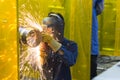 The welding craftsman grinding the steel tube Royalty Free Stock Photo