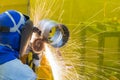 The welding craftsman grinding the steel tube Royalty Free Stock Photo