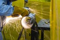 The welding craftsman grinding the steel tube Royalty Free Stock Photo