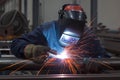 Welding expertise Professional heavy industry welder in focused action indoors Royalty Free Stock Photo