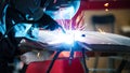 Welding industrial: worker in helmet repair detail in car service Royalty Free Stock Photo