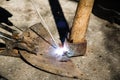 Welding old broken hoe with electrocautery