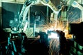 Welding robots movement in a car factory Royalty Free Stock Photo