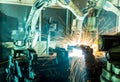 Welding robots movement in a car factory Royalty Free Stock Photo