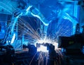 Welding robots movement in a car factory Royalty Free Stock Photo