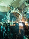 Welding robots movement in a car factory Royalty Free Stock Photo