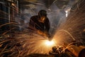 welding sparks fly as metal is joined in factory