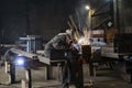 Welding with sparks by Process fluxed cored arc welding ,Industrial steel welder part in factory welder Industrial Royalty Free Stock Photo