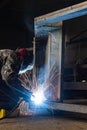 Welding with sparks by Process fluxed cored arc welding ,Industrial steel welder part in factory welder Industrial Royalty Free Stock Photo