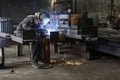 Welding with sparks by Process fluxed cored arc welding ,Industrial steel welder part in factory welder Industrial Royalty Free Stock Photo