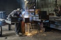 Welding with sparks by Process fluxed cored arc welding ,Industrial steel welder part in factory welder Industrial Royalty Free Stock Photo