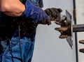 Welding steel worker grinding and burrs from perfect spiral welds Royalty Free Stock Photo