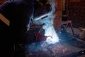 Semi-automatic welding of metal structures in the shop Royalty Free Stock Photo