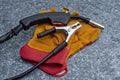Welding torch and grounding clamp with protective work gloves on a galvanized metal background. Industrial welding tools concept Royalty Free Stock Photo