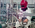 Welding two pipes together with an automated welder.